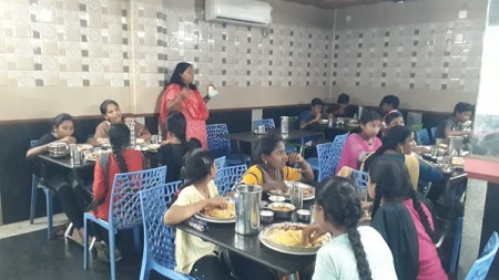 Leena Lavanya and youth eating dinner at a restaurant in India. 